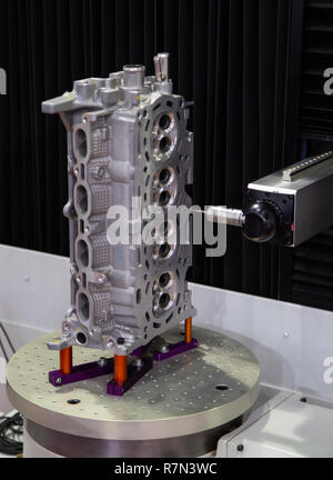CNC Coordinate Measuring Robotic Machine measuring engine part Stock Photo