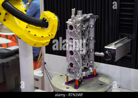 CNC Coordinate Measuring Robotic Machine measuring engine part Stock Photo
