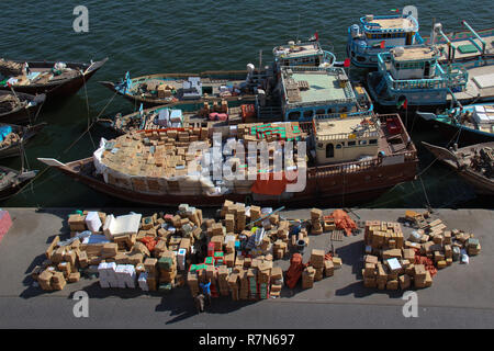 Loading cargo at the Dhow wharfage in Dubai, UAE. Stock Photo