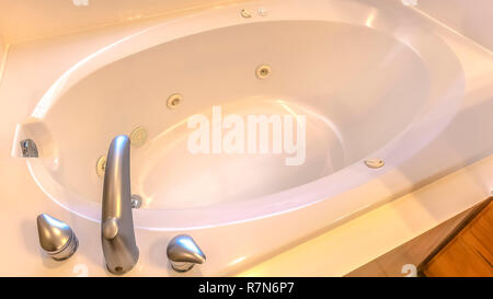 Oval shaped bathtub inside of a modern bathroom Stock Photo
