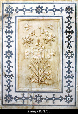 Ancient carved flower on marble in Amber Fort near Jaipur, Rajasthan, India Stock Photo