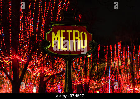 The Metro sign and the Christmas lights of Champs Elysee, Paris, France Stock Photo