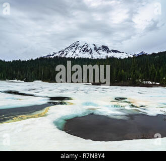 Mount Rainier viewed from frozen and snowy Reflection Lakes, Mt Rainier National Park, Washington state, USA. Stock Photo