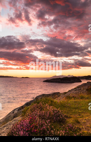 Sunset view from Ardtoe, Ardnamurchan. The Hebridean islands of Rum and Eigg can be seen in the distance. Stock Photo