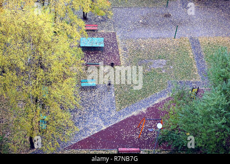 Fall of the leaves in the city park in autumn day, lot of fallen leaves on the ground top view Stock Photo