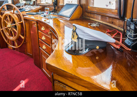 Hat naval officer of Nave Italia. Nave Italia is the biggest sailing brig in the world. Port of Livorno, in Tuscany, Italy Stock Photo
