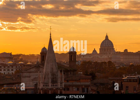 View of Rome historic center skyline with ancient domes and bell towers at sunset Stock Photo