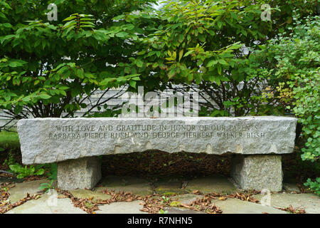 Stone bench dedicated to Barbara and George Bush by their children. The bench is on the grounds of Saint Anns church in Kennebunkport, Maine, USA. Stock Photo
