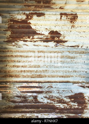 old detailed aged vintage rusty corrugated red brown silver textured zinc metal sheet exterior fence used in construction industry as house building m Stock Photo