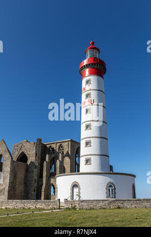 Ruins of Saint Mathieu abbey in Finistere and the top of a lighthouse ...