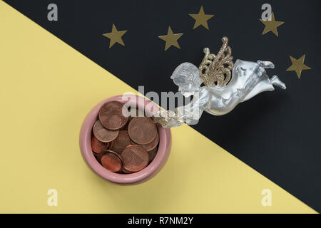 White Angel on the night starry sky fills the cup of plenty. Wealth and abundance. Concept of spiritual and material Stock Photo