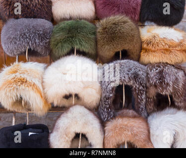 Fur caps winter headwear. Trading with fur hat. Selling natural winter fur headdress Stock Photo