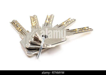 Five security keys on ring isolated on white Stock Photo