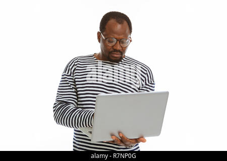 Serious adult man working on his laptop Stock Photo