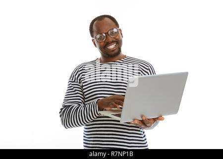 Positive nice man working on his laptop Stock Photo