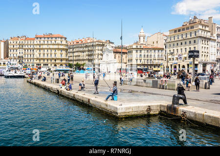 The quai des Belges seen from the basin of the Old Port in Marseille, France, with the metro station and the church of Saint-Ferréol les Augustins. Stock Photo