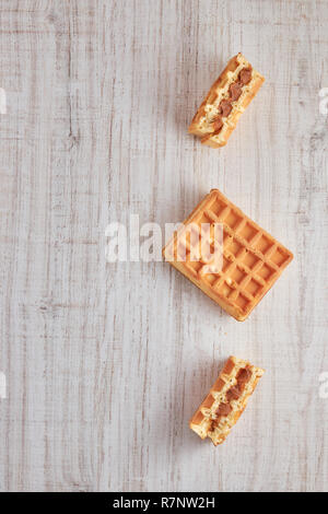 Top view of sweet fresh Viennese waffles. isolated on a wooden table. Copy space pastries for breakfast. Stock Photo