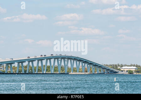 Sanibel Island, USA - April 29, 2018: Bay during sunny day with toll bridge causeway bridge highway road and cars traffic, in holiday vacation destina Stock Photo