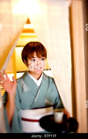 France, Paris, Japanese restaurant Okuda, waitress in traditional dress Stock Photo