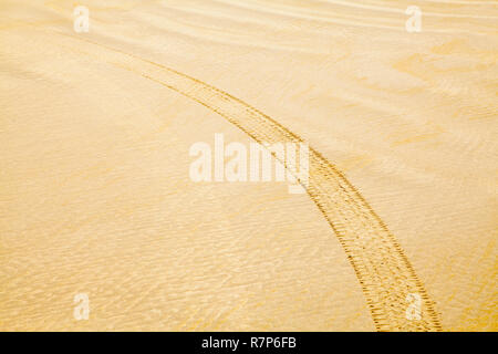 Beach Sand Pattern with Tire Mark Background. Stock Photo