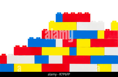 Plastic Toy Brick Wall Isolated on a White Background. Stock Photo