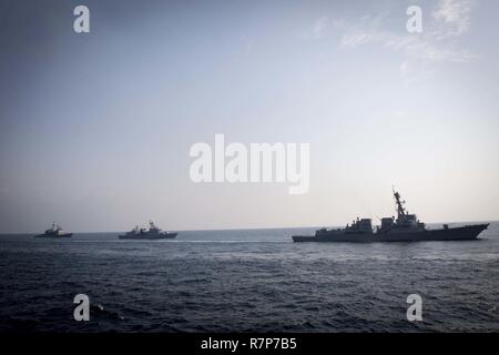 WATERS EAST OF THE KOREAN PENINSULA (March 22, 2017) The Arleigh Burke-class guided-missile destroyer USS Wayne E. Meyer (DDG 108), the Republic of Korea Navy destroyer ROKS Gwanggaeto the Great (DDH 971), and USS Mitscher (DDG 57) steam behind USS Stethem (DDG 63) as the ships participate in surface maneuvers with several other U.S. and Republic of Korea Navy ships and submarines during Foal Eagle (FE) 17. FE 17 is a series of annual training events designed to increase readiness to defend the ROK, protect the region, and maintain stability in the Korean Peninsula. Stock Photo