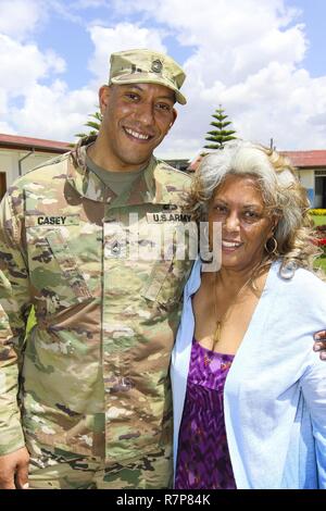 Master Sgt. Bakaffa Casey, an information technology manager with U.S. Army Africa, and his mother, whom his has not seen in since 1999, pose for a photo after having lunch at the Peace Support Training Center in Addis Ababa, Ethiopia. Casey was able to reunite with his mother, and extended family members, because he was here in support of Justified Accord 17, which was held March 20-24, 2017. JA17 is an annual weeklong joint exercise that brings together U.S. Army personnel, African partners, allies and international organizations to promote interoperability between participating nations for  Stock Photo