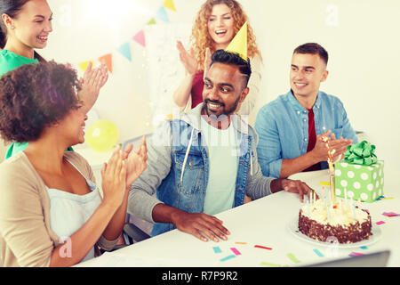 office team greeting colleague at birthday party Stock Photo