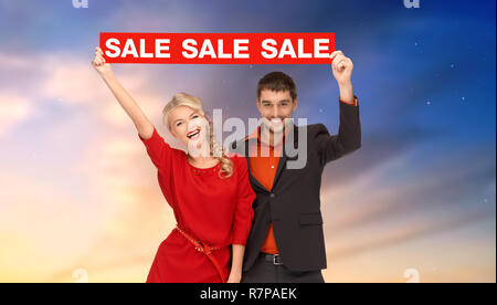 couple with red sale sign Stock Photo