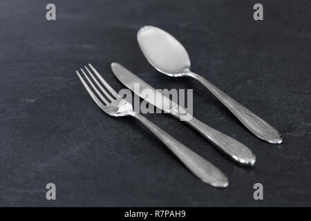 close up of fork, knife and spoon on table Stock Photo