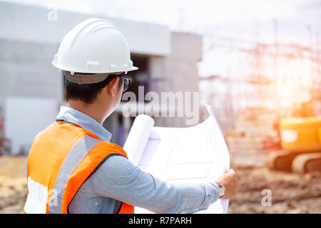 Asian architect or civil engineer at the construction site. Stock Photo