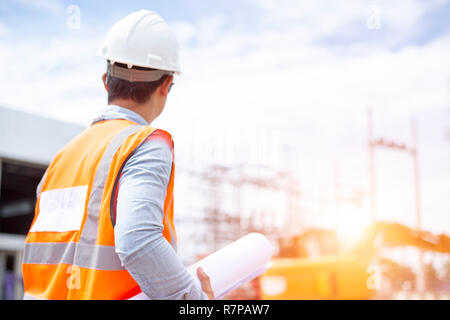 civilAsiatic engineers are work inspecting the electric building Stock Photo
