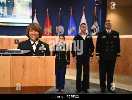 AUSTIN, Texas (March 23, 2017) Vice Adm. Raquel Bono, director of the Defense Health Agency Medical Corps, speaks at the Austin City Hall after being introduced by Mayor Steve Adler during Navy Week Austin. Navy Week programs serve as the Navy's principal outreach effort in areas of the country without a significant Navy presence. Stock Photo