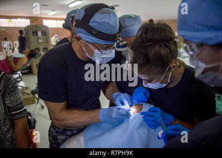 MAYAPO, Colombia (March 25, 2017) - Cmdr. Christopher Crecelius, a native of Sequim, Wash., attached to Walter Reed National Military Medical Center, Bethesda, Md., performs reconstructive eye surgery at the Continuing Promise 2017 (CP-17) medical site in Mayapo, Colombia. CP-17 is a U.S. Southern Command-sponsored and U.S. Naval Forces Southern Command/U.S. 4th Fleet-conducted deployment to conduct civil-military operations including humanitarian assistance, training engagements, and medical, dental, and veterinary support in an effort to show U.S. support and commitment to Central and South  Stock Photo