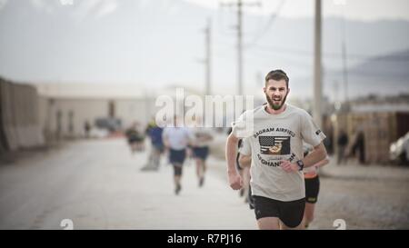 Runners participate in a 10-kilometer race during Freedom Fest March 25, 2017 at Bagram Airfield, Afghanistan. Freedom Fest was an event put on by the 455th Expeditionary Force Support Squadron and private organizations. Stock Photo