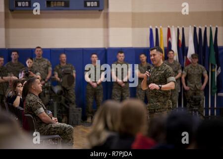 U.S. Marine Corps Lt. Col. Brett T. McGinley, commanding officer of Infantry Training Battalion, School of Infantry-East, addresses guests during the Bravo Company graduation aboard Camp Geiger, N.C., March 23, 2017. Lt. Col. McGinley spoke to the friends and families of the Marines who graduated that day. Stock Photo