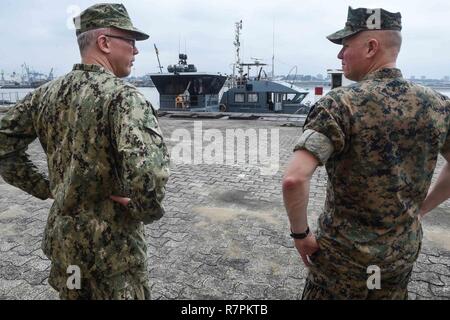 DOUALA, Cameroon (March 27, 2017) U.S. Marine Corps Col. Patrick Keane from Long Island, N.Y., (right) meets with Capt. Mike Coleman (left) from Washington, during a site visit to the Cameroonian coastal monitoring operations center during exercise Obangame Express March 27, 2017. Obangame Express 2017, sponsored by U.S. Africa Command, is designed to improve regional cooperation, maritime domain awareness , information-sharing practices, and tactical interdiction expertise to enhance the collective capabilities of Gulf of Guinea and West African nations to counter sea-based illicit activity. Stock Photo