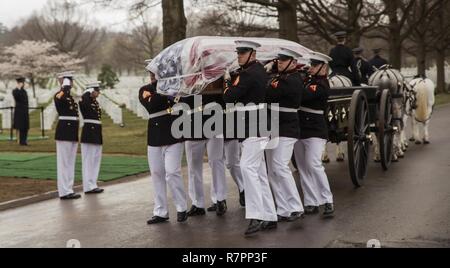 Body Bearers from Marine Barracks Washington lay Pvt. Harry K. Tye to rest at Arlington National Cemetery, Mar. 28, 2017. Pvt. Tye was killed on Nov. 20, 1943 during the Battle of Tarawa. His remains were recovered by History Flight from Cemetery 27 on Tarawa and interned on U.S. soil. Stock Photo