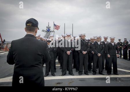 JEJU JOINT CIVIL-MILITARY COMPLEX, Republic of Korea (March 25, 2017) Rear Adm. Brad Cooper, commander of U.S. Naval Forces Korea, speaks to Sailors assigned to the Arleigh Burke-class guided-missile destroyer USS Stethem (DDG 63), the first U.S. Navy vessel to visit Joint Civil-Military Complex on the island of Jeju-do. Stethem is on patrol in the waters east of the Korean peninsula supporting security and stability in the Indo-Asia-Pacific region. Stock Photo