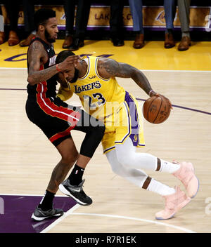 Los Angeles, California, USA. 10th Dec, 2018. Los Angeles Lakers' LeBron James (23) drives against Miami Heat's Derrick Jones Jr. (5) in an NBA basketball game between Los Angeles Lakers and Miami Heat Monday, Dec. 10, 2018, in Los Angeles. LeBron James and Dwyane Wade met for the 31st time as opponents on Monday night as the Lakers beat the Heat 108Ã105 at the Staples Credit: Ringo Chiu/ZUMA Wire/Alamy Live News Stock Photo