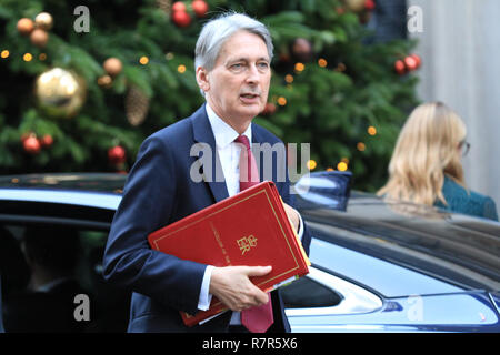 Downing Street, London, UK, 11th Dec 2018. Philip Hammond, Chancellor of the Exchequer, enters No 10 Downing Street. Credit: Imageplotter News and Sports/Alamy Live News Stock Photo
