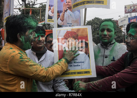 Kolkata, India. 11th Dec, 2018. Supporters of the Indian National Congress (INC) celebrate election results in Kolkata, India, Dec. 11, 2018. After over 10 hours of continuous counting of votes in five states that went to polls recently, India's main opposition party the INC seemed comfortably positioned on Tuesday to grab three major states -- Madhya Pradesh, Chhattisgarh and Rajasthan, from the main ruling Bharatiya Janata Party (BJP). Credit: Tumpa Mondal/Xinhua/Alamy Live News Stock Photo