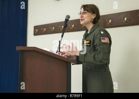 NORFOLK (March 29, 2017) Cmdr. Brandy McNabb, the commanding officer at Naval Consolidated Brig, speaks at the aircraft carrier USS George Washington's (CVN 73) women's history month observance event. McNabb and four other officers participated in the first all-female E-2C Hawkeye combat mission, Jan. 25, 2012. George Washington is homeported in Norfolk preparing to move to Newport News, Virginia for the ship’s refueling complex overhaul (RCOH) maintenance. Stock Photo