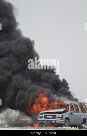 Civilian and military personnel from Kuwait, Saudi Arabia and the U.S. conducted counterterrorism drills as part of Eagle Resolve 2017 near Kuwait International Airport, March 28, 2017. Urban warfare specialists conducted search and rescue operations and responded to a mock vehicle explosion (pictured). Since 1999, Eagle Resolve - involving over 1,000 U.S. military personnel - has become the premier multi-national exercise between U.S. and Gulf Cooperation Council nations to collectively address the regional challenges in a low-risk setting. Stock Photo