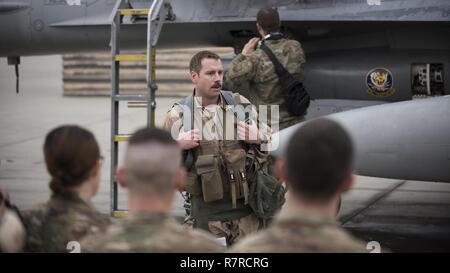 Lt. Col. Craig Andrle, 79th Expeditionary Fighter Squadron commander, speaks to squadron members after flying his 1,000th combat hour March 20, 2017 at Bagram Airfield, Afghanistan. There are only four F-16 Fighting Falcon pilots, lieutenant colonel and below, currently serving in the Air Force who have reached 1,000 combat hours. Stock Photo