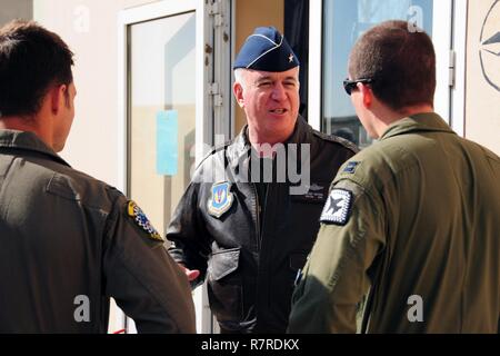 Brig. Gen. Robert Huston, mobilization assistant to the Vice Commander, Third Air Force and 17th Expeditionary Air Force, speaks with military participants during a media day during INIOHOS 17 at Andravida Air Base, Greece, Mar. 29, 2017. Huston along with U.S. Ambassador to Greece, Geoffrey Pyatt, attended, where an overview of the annual exercise took place. Stock Photo