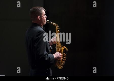 AMES, Iowa (March 30, 2017) Musician 1st Class Dana Booher performs with the United States Navy Band during a concert at Iowa State University's Stephens Auditorium in Sioux City, Iowa. The U.S. Navy Band performed in nine states during its 23-city national tour, connecting the Navy to communities that don't see Sailors at work on a regular basis. Stock Photo