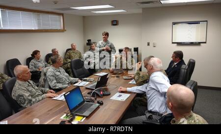 Maj. Gen. Timothy Orr, The Adjutant General of the Iowa National Guard, visits the Fort Dodge Army and Air National Guard facilities on Thursday, March 30, 2017. Lt. Col. Robin Hosch, Commander of the 133rd Test Squadron, gives the general and staff an initial briefing before a tour of the facility. (National Guard Stock Photo