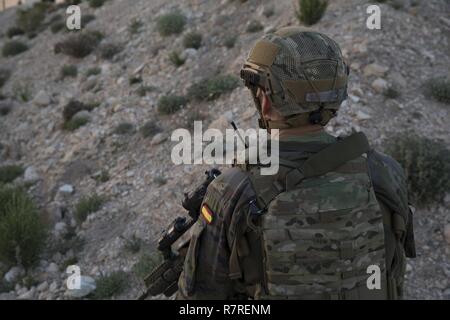 A Spanish 2nd Special Operations Group “Granada” member speaks into a radio during a bilateral Military Operation on Urbanized Terrain exercise with Special Purpose Marine Air Ground Task Force-Crisis Response-Africa Marines in Alicante, Spain, March 29, 2017. The exercise provided an opportunity for Marines and Spanish SOF members to improve interoperability, maintain joint readiness and strengthen relationships. Stock Photo