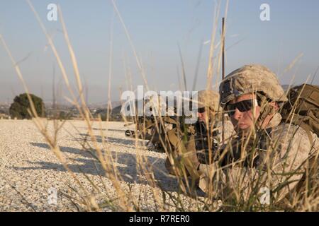 U.S. Marines assigned to Special Purpose Marine Air Ground Task Force-Crisis Response-Africa provide security during a bilateral Military Operation on Urbanized Terrain exercise with the Spanish 2nd Special Operations Group “Granada” in Alicante, Spain, March 29, 2017. The exercise provided an opportunity for Marines and Spanish SOF members to improve interoperability, maintain joint readiness and strengthen relationships. Stock Photo